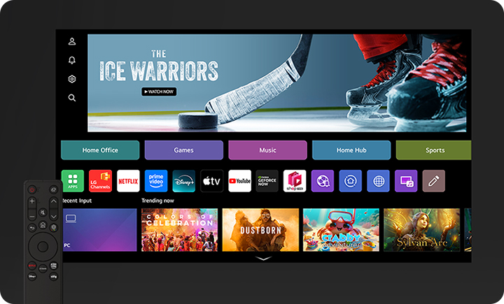 TV 화면에는 THE ICE WARRIORS라는 텍스트와 함께 아이스하키 스틱과 스케이트가 보입니다. 화면 아래에는 Home Office, Games, Music, Home Hub, Sports 등의 메뉴가 있습니다. 여러 앱 아이콘이 나열되어 있으며, CH, Netflix, Prime Video, Disney+, YouTube 등이 포함되어 있습니다. 하단에는 Recent Input과 Trending now 섹션이 있으며, 다양한 콘텐츠의 이미지가 표시되어 있습니다. 화면 왼쪽에는 리모컨이 보입니다.